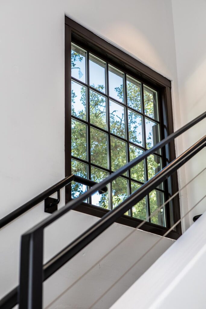 A window inside a house with a tree view